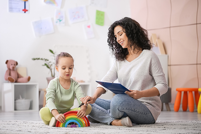 Care provider working with a young child